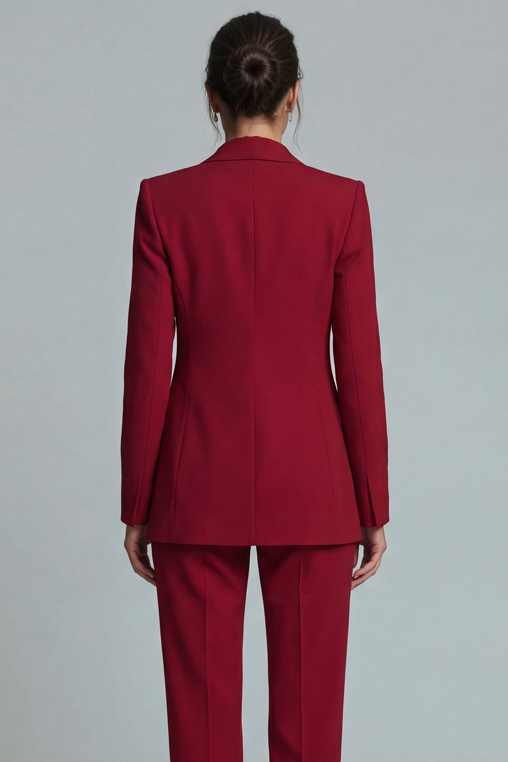 Close-up back view of burgundy fitted blazer with clean structured seams tailored waist and straight-leg trouser – Una Una