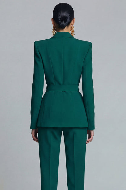 Close-up back view of emerald green fitted blazer with back belt strap structured seams and tailored waist – Una Una

